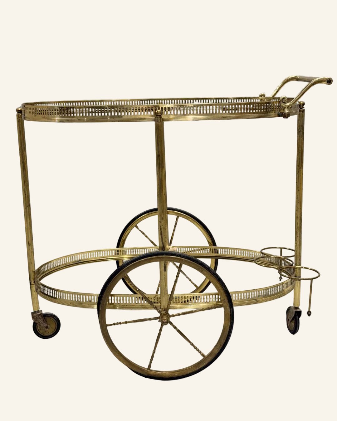 French Mid - Century Brass Bar Cart with Two - Tiered Oval Glass Shelves and Rolling Brass Spoke Wheels - Drue Bohrer Antiques