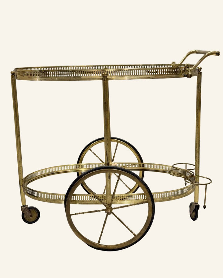 French Mid - Century Brass Bar Cart with Two - Tiered Oval Glass Shelves and Rolling Brass Spoke Wheels - Drue Bohrer Antiques